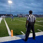 In this Friday, Sept. 20, 2019 photo, official Daryl Wilson keeps a watch on the action as Rejoice Christian takes on Haskell in a high school football game.