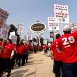 Encore Boston Harbor workers rally and picket outside the hotel and casino in Everett.