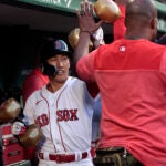 Boston Red Sox designated hitter Masataka Yoshida (7) with the celebratory inflatable dumbbells in the dugout following his solo home run in the second inning.