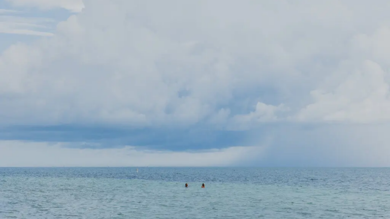 Two people in the ocean.