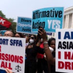 Demonstrators protest outside of the Supreme Court in Washington.