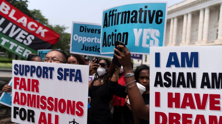 Demonstrators protest outside of the Supreme Court in Washington.