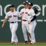 Boston Red Sox outfielders, from left, Masataka Yoshida, Jarren Duran and Alex Verdugo celebrate after defeating the against the Oakland Athletics during a baseball game, Saturday, July 8, 2023, in Boston.