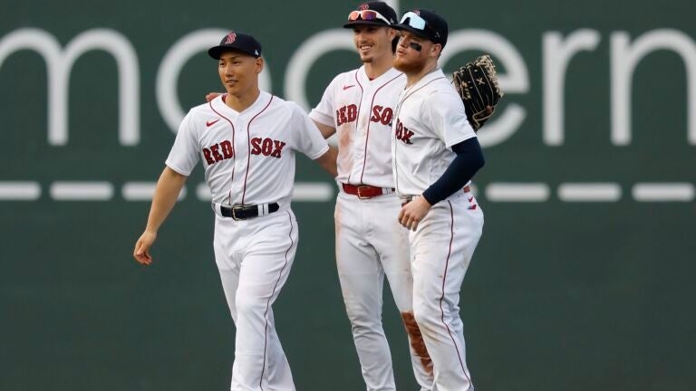 Boston Red Sox outfielders, from left, Masataka Yoshida, Jarren Duran and Alex Verdugo celebrate after defeating the against the Oakland Athletics during a baseball game, Saturday, July 8, 2023, in Boston.