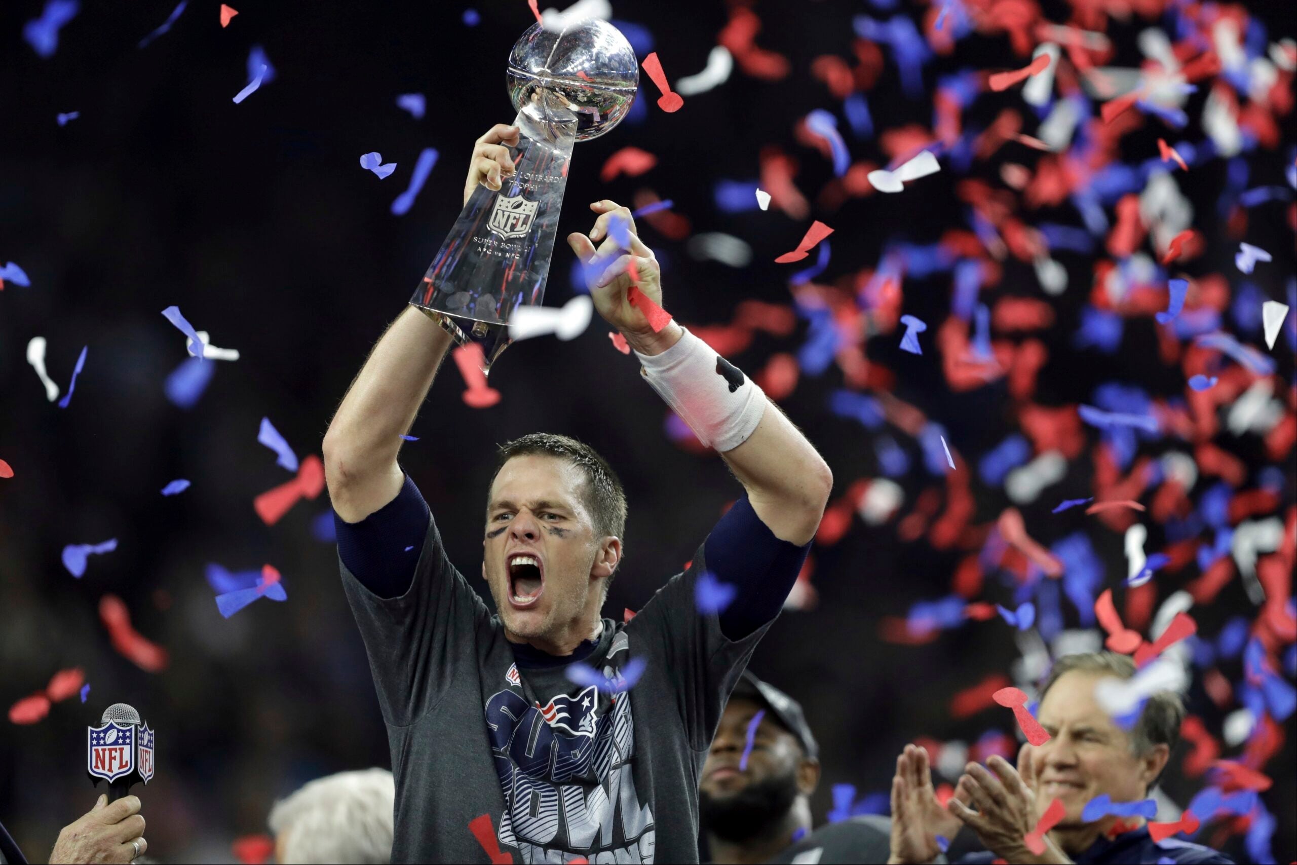 New England Patriots' Tom Brady raises the Vince Lombardi Trophy after defeating the Atlanta Falcons in overtime at the NFL Super Bowl 51 football game Sunday, Feb. 5, 2017, in Houston.