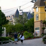 People walk at Mont-Tremblant Resort in Mont-Tremblant, Quebec, on Sunday, July 16, 2023.
