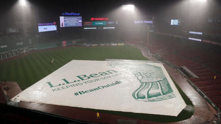 Red Sox fans take advantage of flooded Fenway Park during rain delay