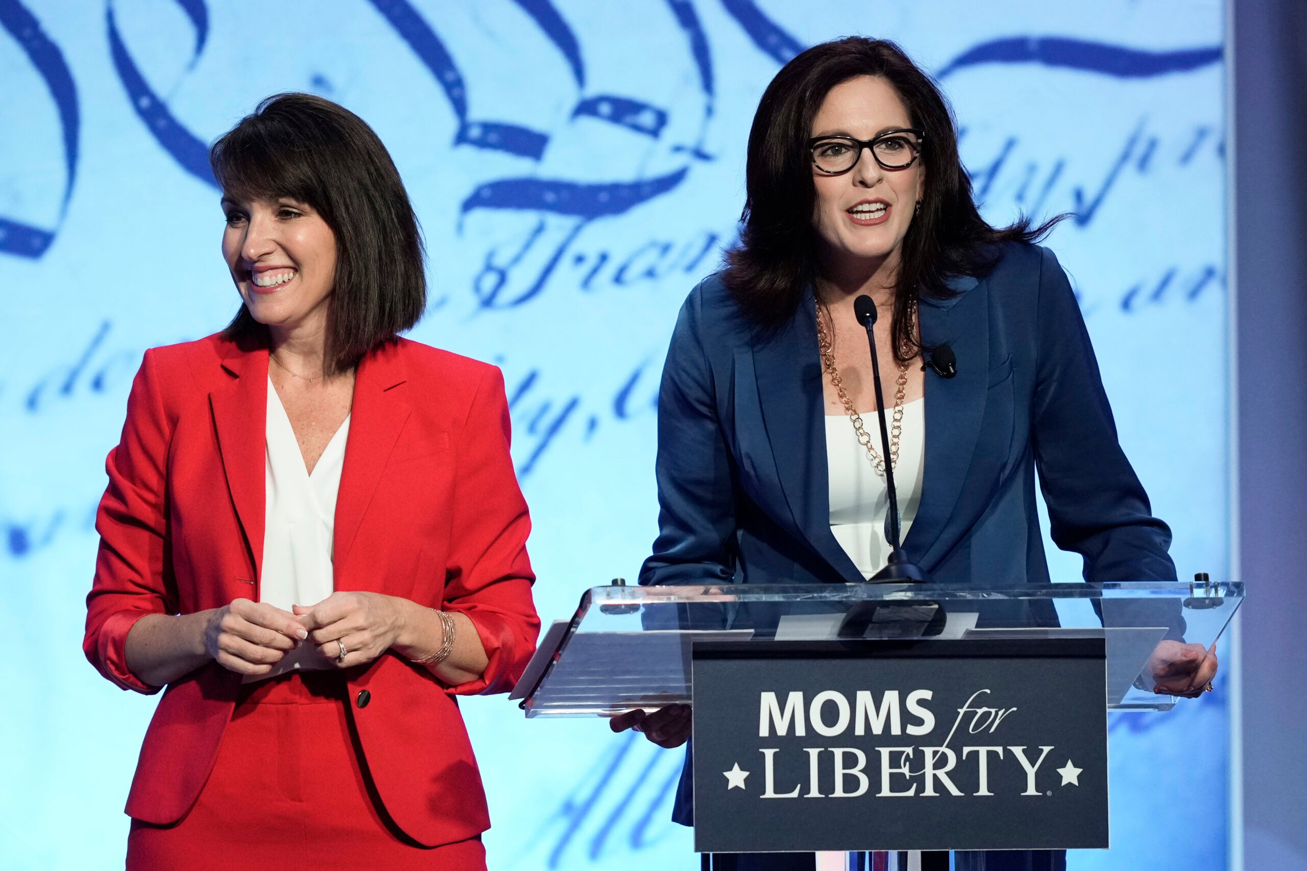 Moms for Liberty co-founders Tina Descovich, left, and Tiffany Justice, speak at the Moms for Liberty meeting in Philadelphia.