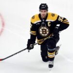 Boston Bruins' Patrice Bergeron warms up before an NHL hockey game against the New York Islanders, Saturday, Feb. 18, 2023, in Boston.