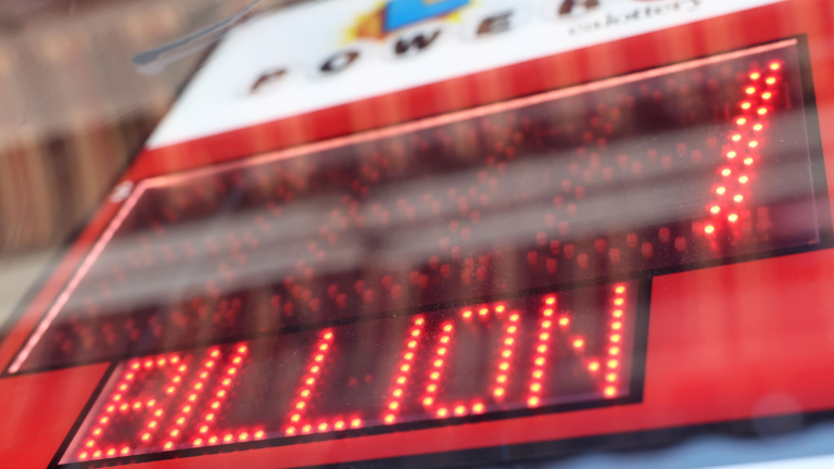 Lottery sign reading $1 billion in red lights.
