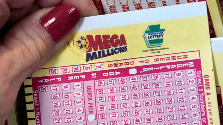 A Mega Millions wagering slip in someone's hand.