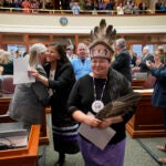 Clarissa Sabattis, Chief of the Houlton Band of Maliseets, foreground, and other leaders of Maine's tribes are welcomed by lawmakers into the House Chamber in Maine.