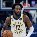 Oshae Brissett holds the ball during a game while playing for the Indiana Pacers.
