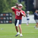New England Patriots quarterback Mac Jones (10) passes the ball during an NFL football practice, Thursday, July 27, 2023, in Foxborough, Mass.