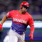 MIAMI, FLORIDA - MARCH 13: Rafael Devers #11 of Team Dominican Republic rounds the bases against Team Nicaragua during the first inning in a World Baseball Classic Pool D game at loanDepot park on March 13, 2023 in Miami, Florida.