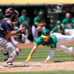 Red Sox catcher Connor Wong prepares to tag out Oakland's JJ Bleday at home during the fifth inning.