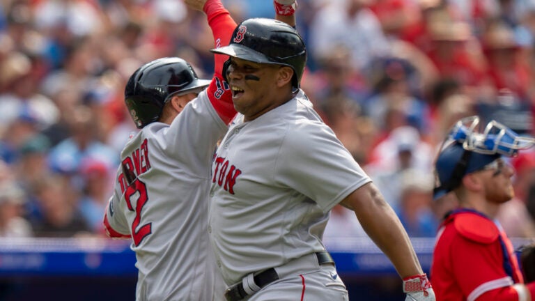 Boston Red Sox third baseman Rafael Devers celebrates his solo HR