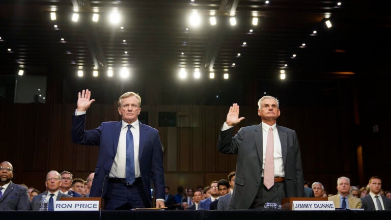 PGA Tour chief operating officer Ron Price, left, and PGA Tour board member Jimmy Dunne are sworn in.