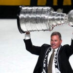 Vegas Golden Knights head coach Bruce Cassidy holds up the Stanley Cup after the Knights defeated the Florida Panthers 9-3 in Game 5 of the NHL hockey Stanley Cup Finals Tuesday, June 13, 2023, in Las Vegas. The Knights won the series 4-1.