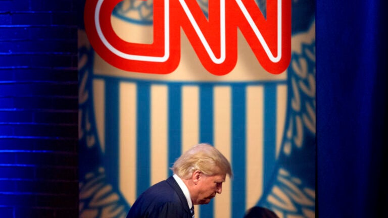 FILE - Then-Republican presidential candidate Donald Trump arrives for a CNN town hall at the University of South Carolina in Columbia, S.C., Feb. 18, 2016.