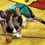 5-30-12: Miami, FL: Miami's Dwayne Wade and the Celtics Paul Pierce divde for a first aquarter loose ball. The Boston Celtics visited the Miami Heat for Game Two of the NBA Eastern Conference Finals at American Airlines Arena.