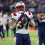 New England Patriots running back Damien Harris warms up before they play the Minnesota Vikings during NFL action at U.S. Bank Stadium.