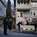 Protesters in front of Mayor Michelle Wu's home in 2022.
