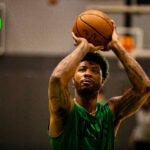 Celtics guard Marcus Smart shoots free throws at practice.