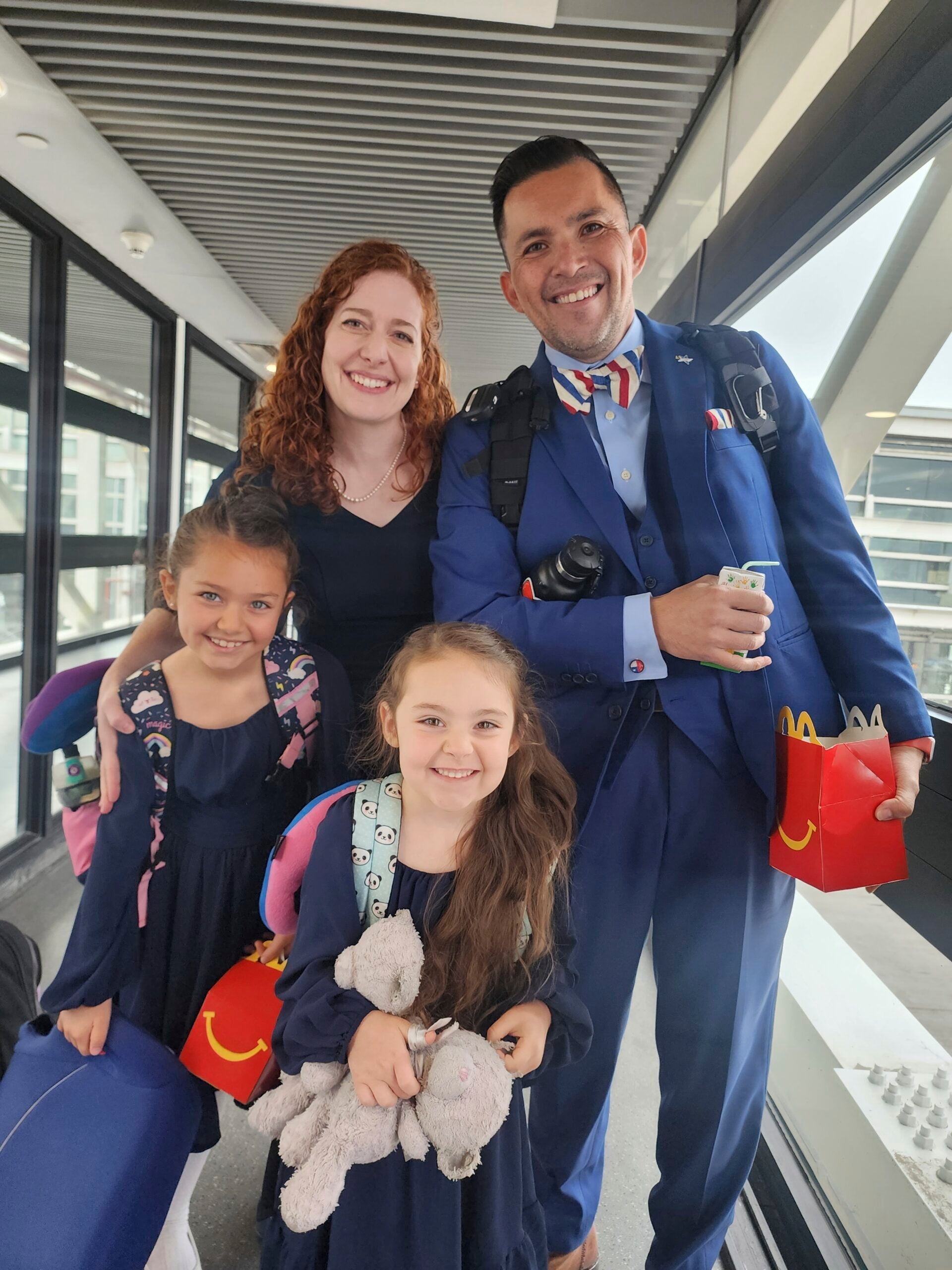 Jimmy Thyden poses for a photo with his wife Johannah, and their two daughters, Ebba Joy, 8, left, and Betty Grace, 5, center, at the Valdivia Airport in Valdivia, Chile.