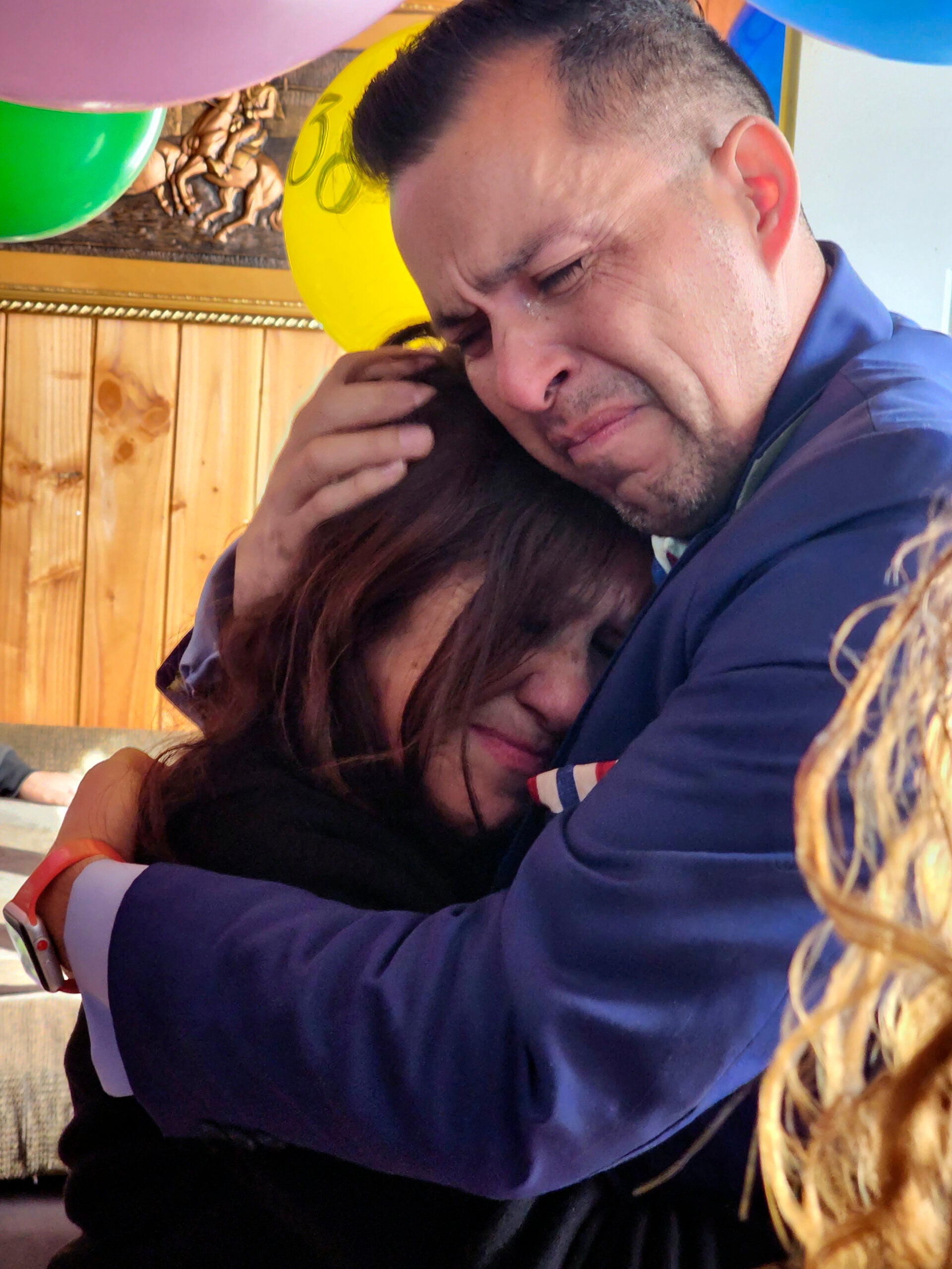 Jimmy Thyden, right, hugs Maria Angelica Gonzalez, his Chilean birth mother.