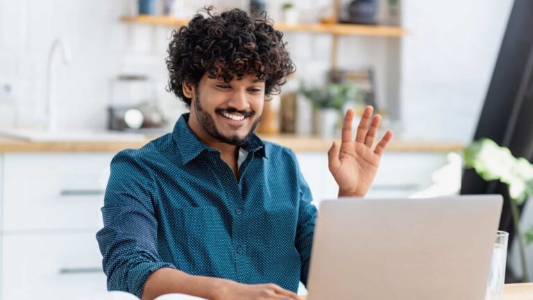 A man at a computer is used to illustrate a story on remote workers.