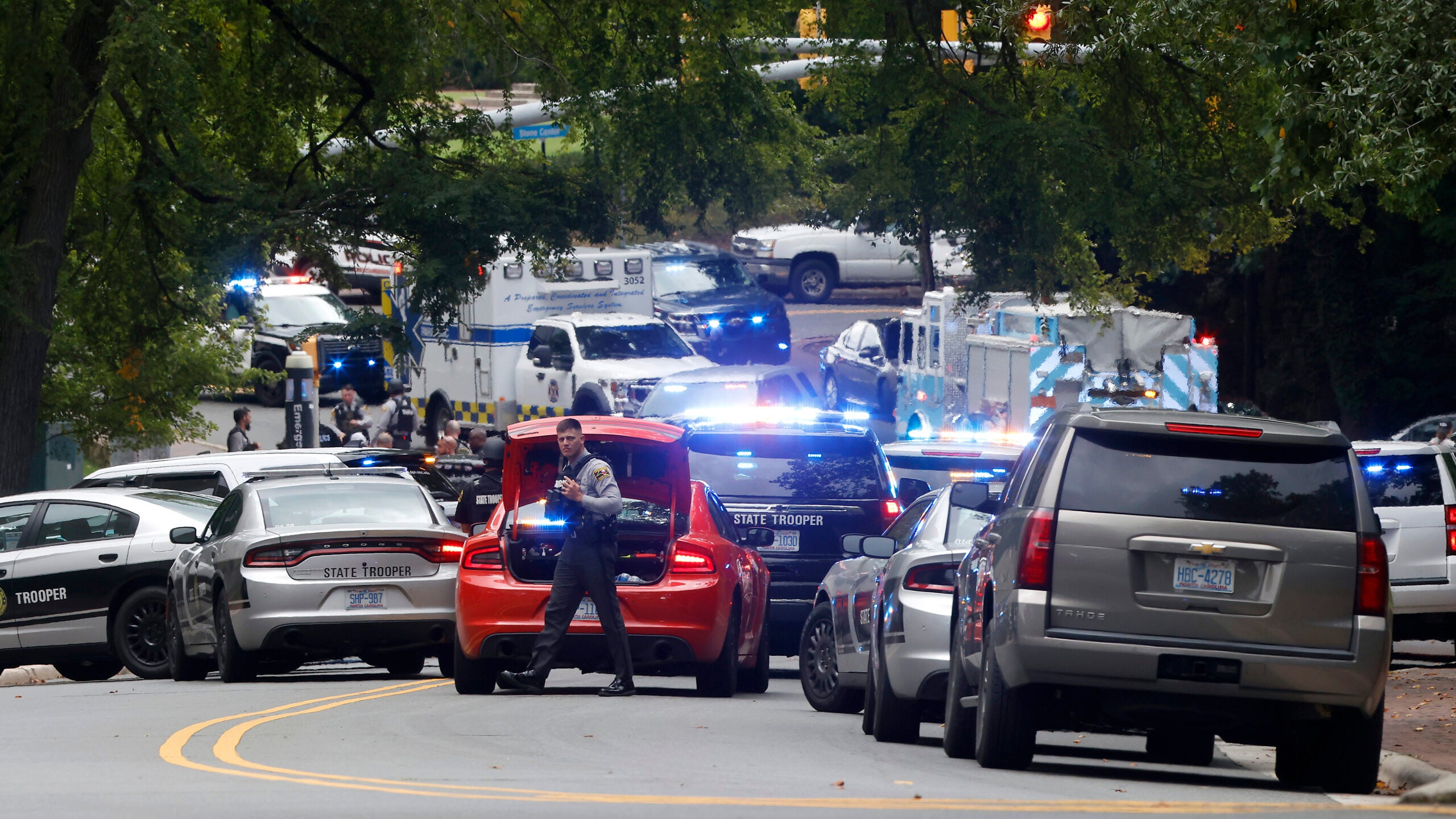 Law enforcement and first responders gather on South Street near the Bell Tower on the University of North Carolina at Chapel Hill campus in Chapel Hill, N.C., Monday, Aug. 28, 2023.
