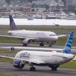 Two planes at Boston Logan Airport.