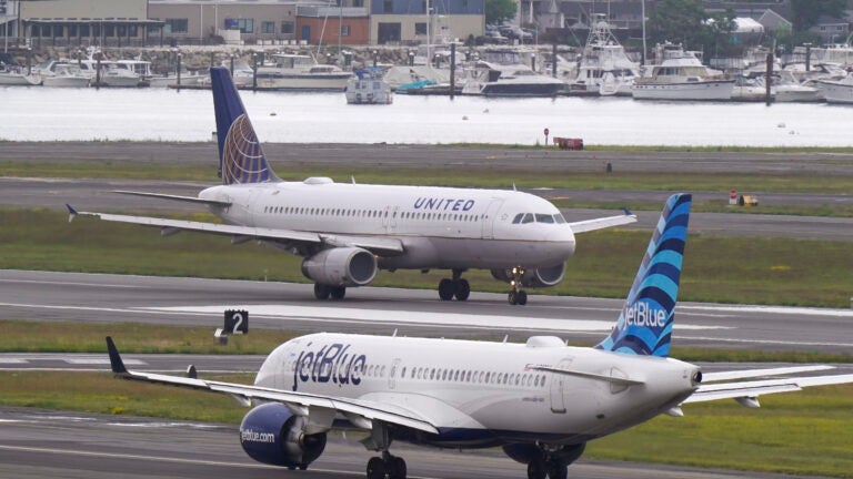 Two planes at Boston Logan Airport.