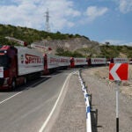 Trucks with humanitarian aid for Artsakh parked in a road towards the separatist region of Nagorno-Karabakh.
