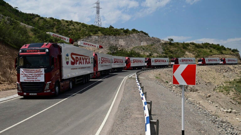 Trucks with humanitarian aid for Artsakh parked in a road towards the separatist region of Nagorno-Karabakh.