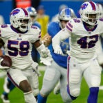 Buffalo Bills linebacker Andre Smith (59) runs behind linebacker Joe Giles-Harris (42) during the second half of a preseason NFL football game against the Detroit Lions, Friday, Aug. 13, 2021, in Detroit.