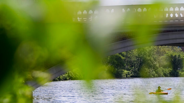 Boston weather -- A kayaker paddles on the Charles River at Riverbend Park along Memorial Drive in Cambridge.