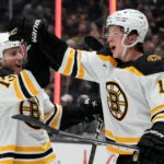 Boston Bruins center Trent Frederic, right, celebrates his goal with center Charlie Coyle during the third period of an NHL hockey game against the Los Angeles Kings Thursday, Jan. 5, 2023, in Los Angeles.