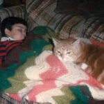 Jimmy Thyden as a child with cat Rusty.