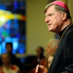 Catholic Bishop Robert J. McManus says the blessing before the annual Bishop's Christmas Dinne on Dec. 25, 2012, at St. Paul's Cathedral in Worcester, Mass.