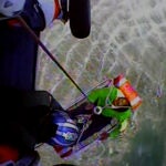 In this image taken from U.S. Coast Guard video, one of three fishermen is rescued from ocean waters by the Coast Guard five miles east of the island of Nantucket off the Cape Cod, Mass., coast Saturday, Aug. 5, 2023.