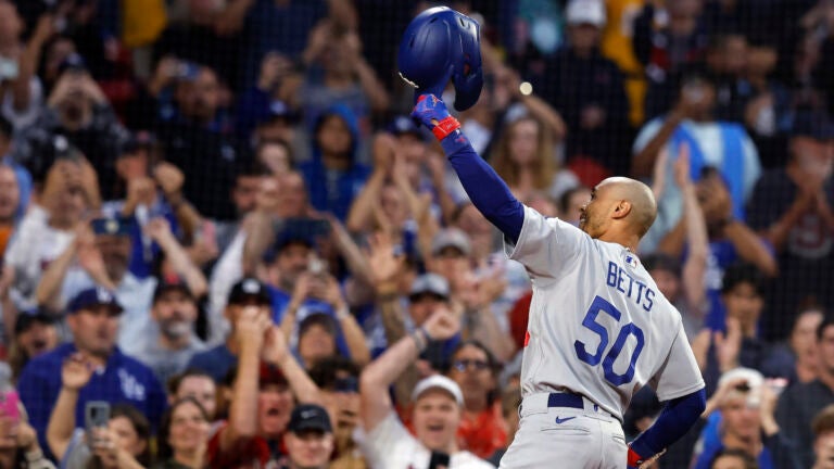 Los Angeles Dodgers' Mookie Betts tips his helmet as he comes up to bat against the Boston Red Sox during the first inning of a baseball game Friday, Aug. 25, 2023, in Boston.