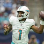 Miami's Tua Tagovailoa gets ready to throw a football.