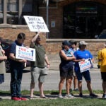 A small group of protestors gather during a "rosary rally" in Norwood, Ohio.