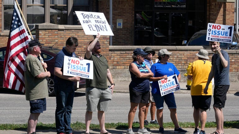 A small group of protestors gather during a "rosary rally" in Norwood, Ohio.