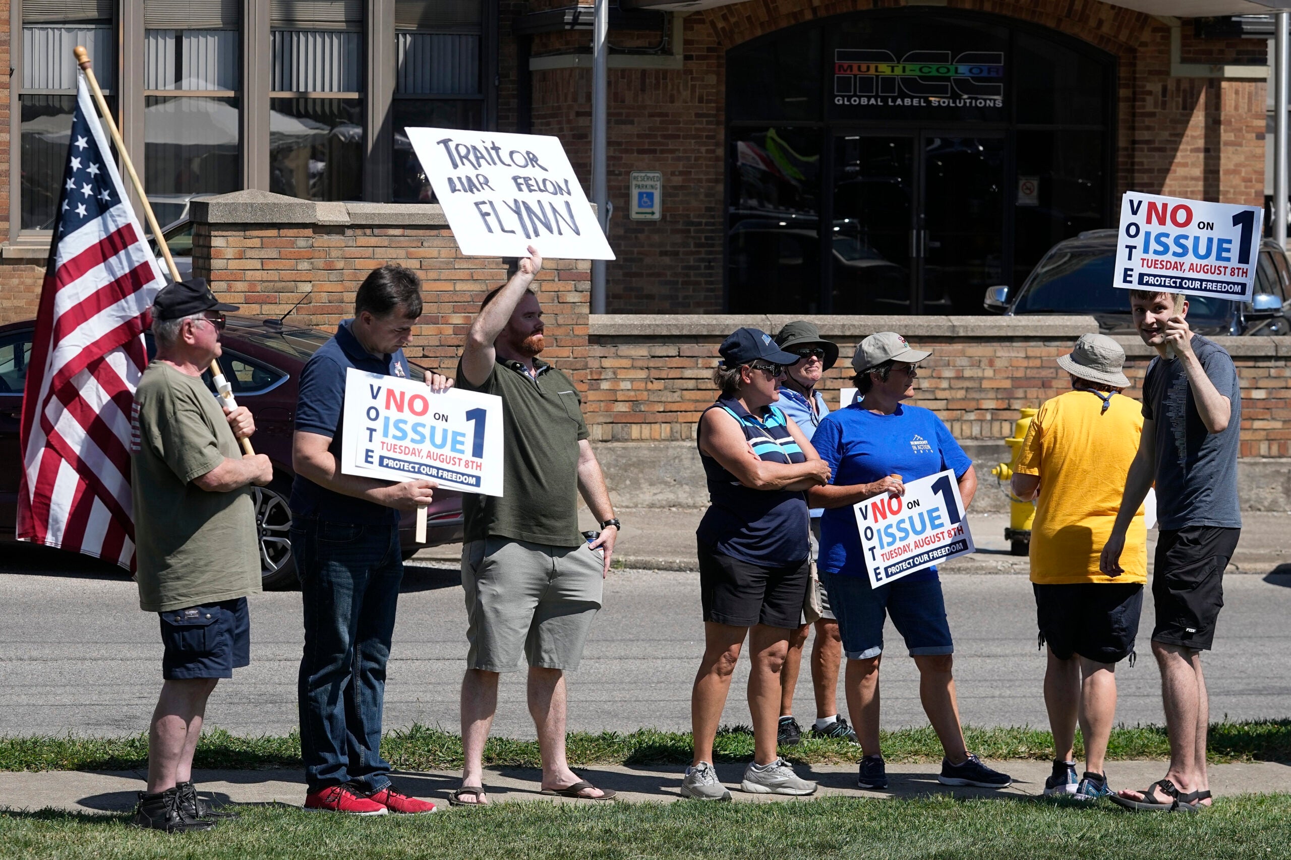 A small group of protestors gather during a "rosary rally" in Norwood, Ohio.