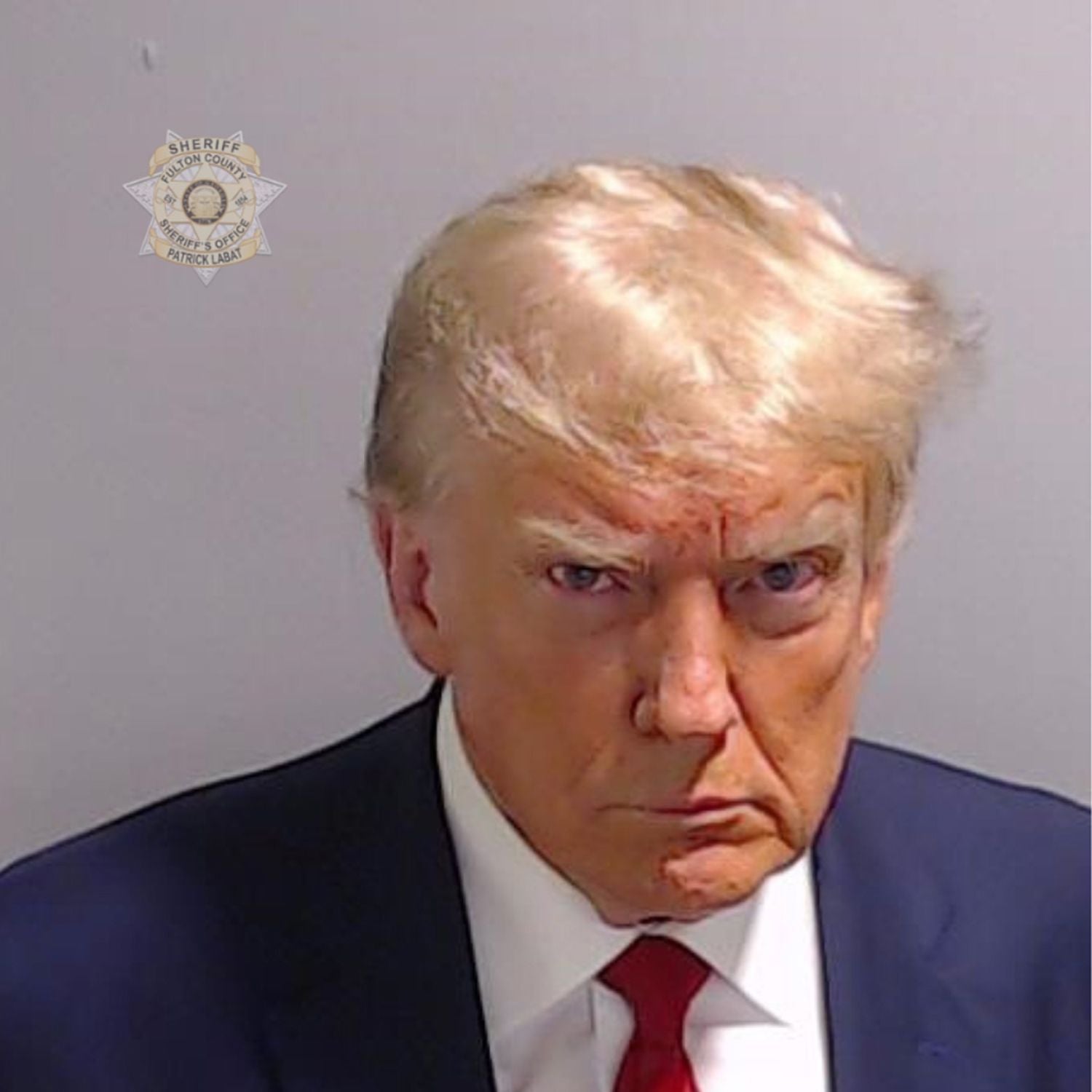 In this handout provided by the Fulton County Sheriff's Office, former U.S. President Donald Trump poses for his booking photo at the Fulton County Jail on August 24, 2023 in Atlanta, Georgia.