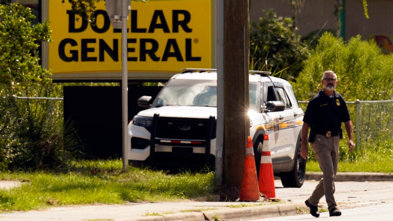 Law enforcement officials investigate the scene of a mass shooting in Jacksonville, Fla.