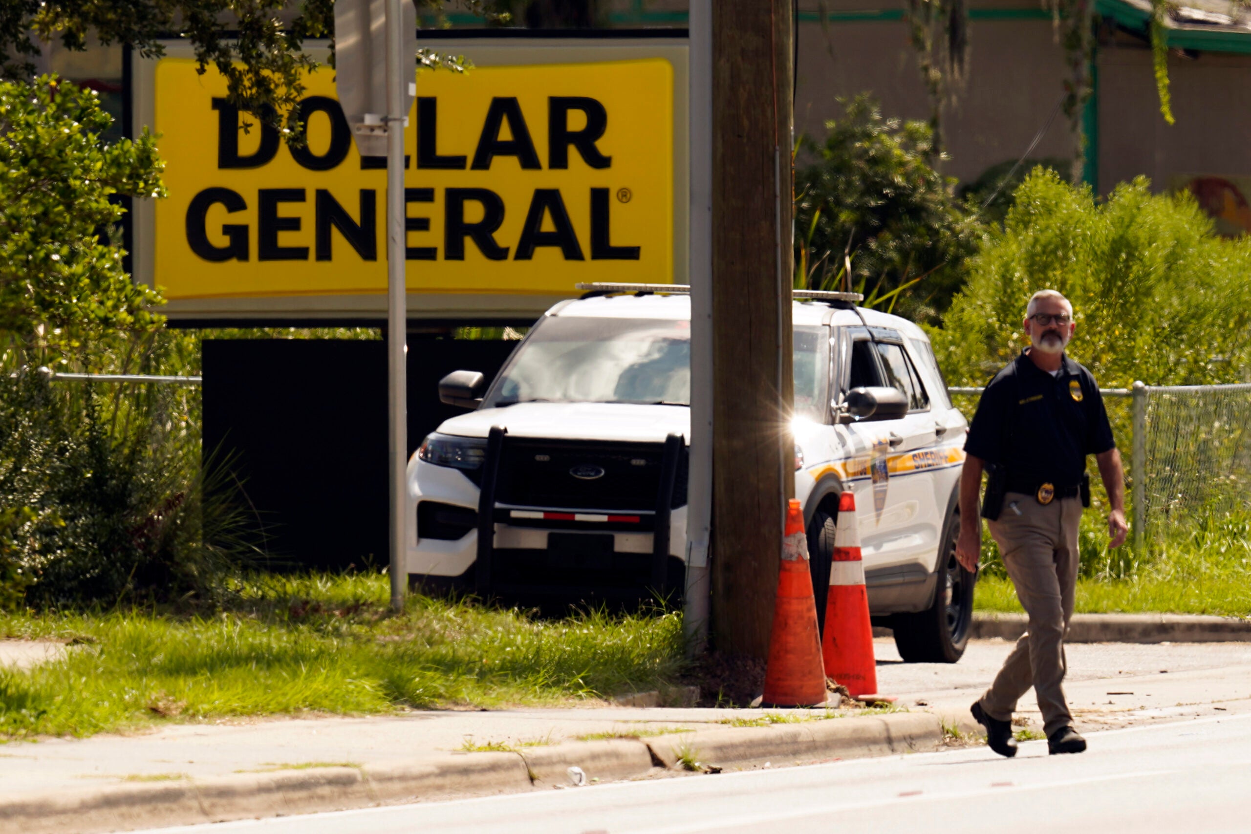 Law enforcement officials investigate the scene of a mass shooting in Jacksonville, Fla.